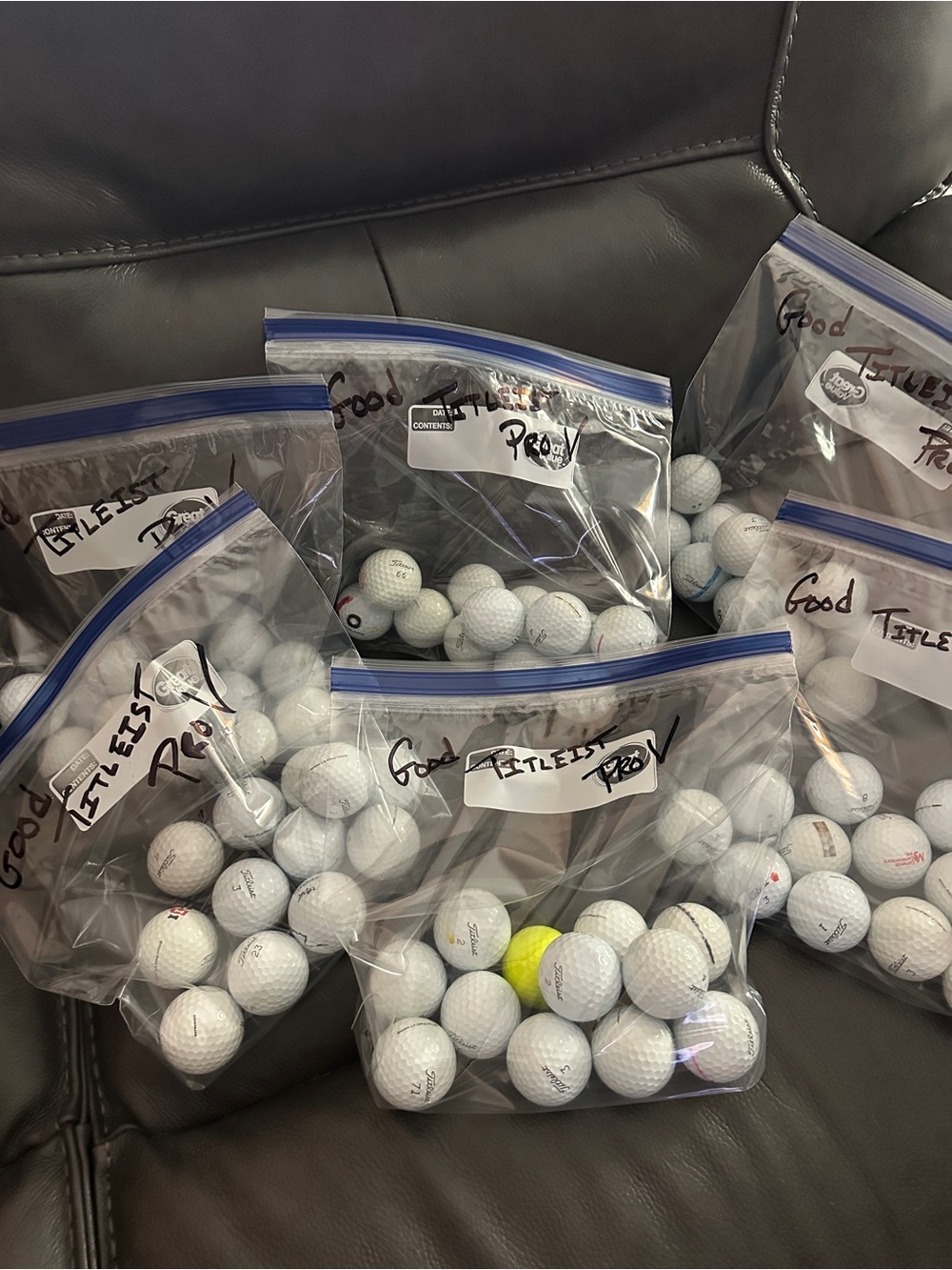 Dozens of Titleist Pro V Golf Balls sold by dozen.